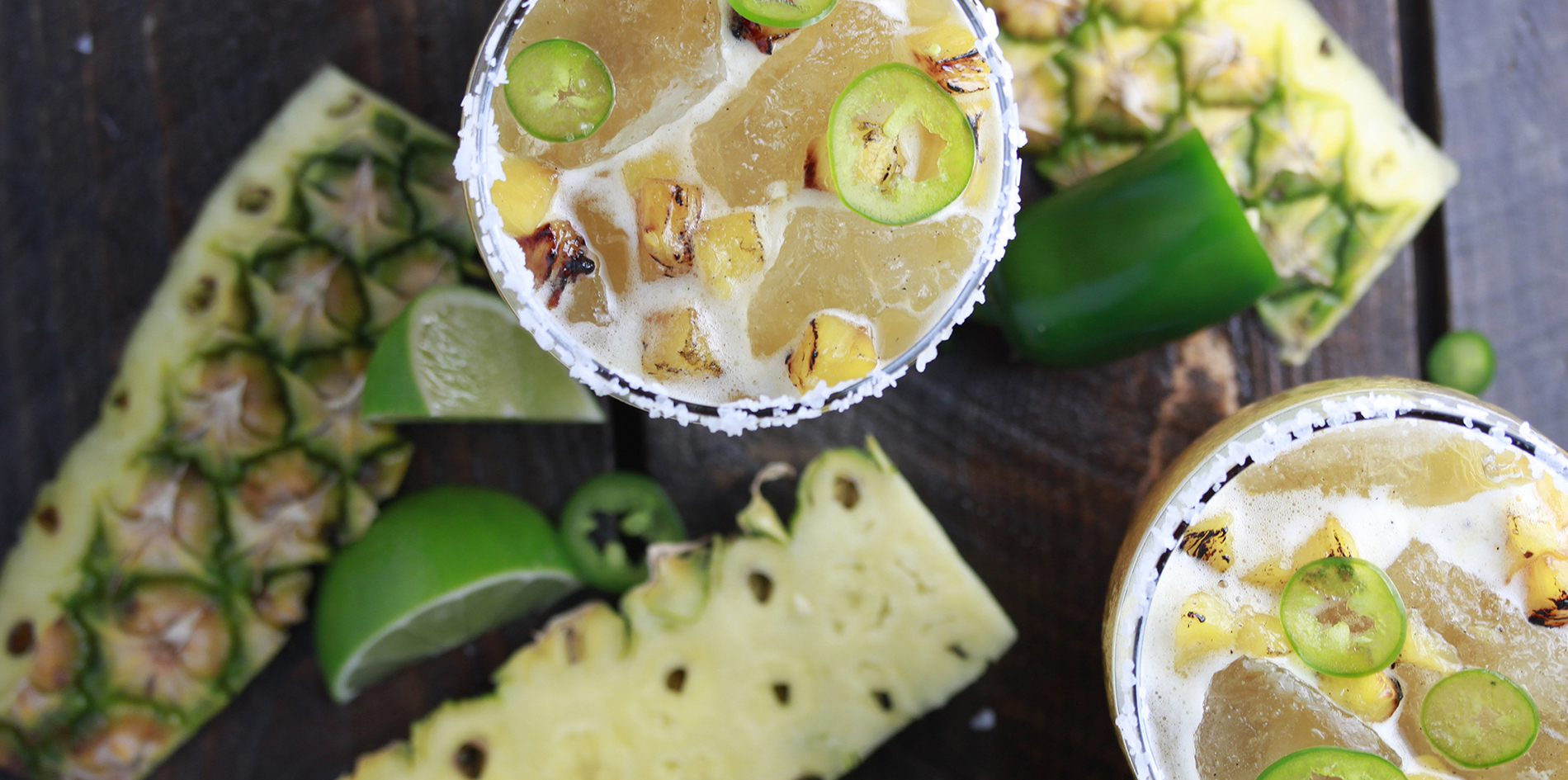 Spicy Pineapple Margarita features fire roasted pineapple purée with roasted pineapple and jalapeño