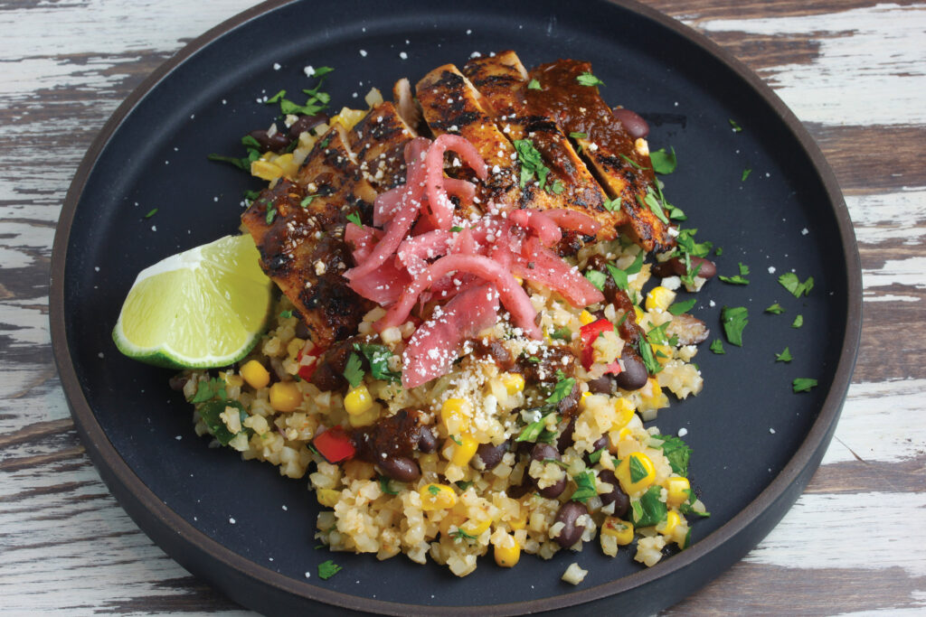 Featuring Haliburton Cilantro-Lime Cauliflower Rice with Black Beans, Fire Roasted Corn and Peppers. Dark-Roasted Chile De Arbol Salsa, Citrus-Pickled Onions and Queso Fresco